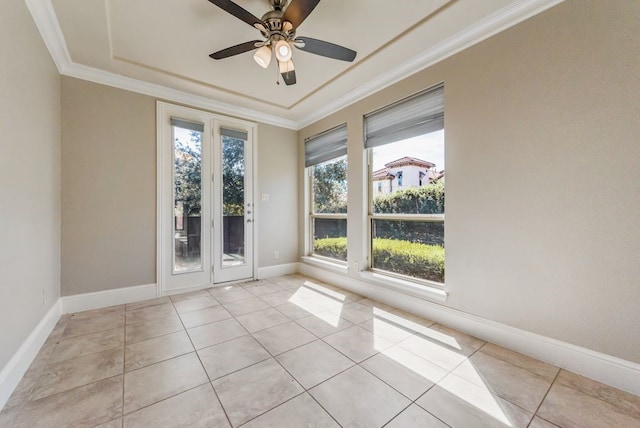 tiled spare room featuring crown molding, plenty of natural light, and ceiling fan