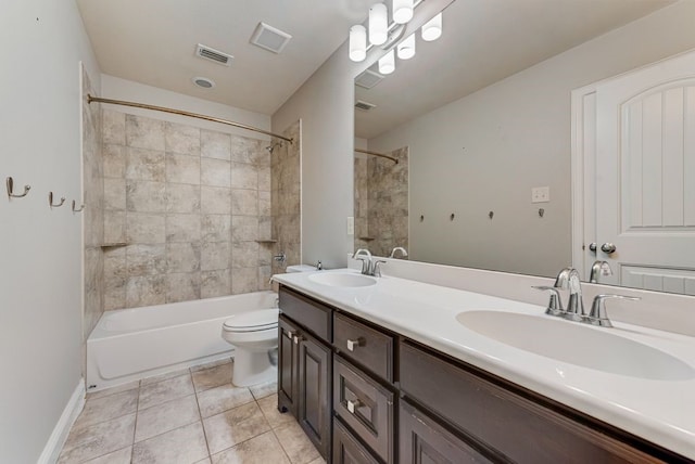 full bathroom featuring tile patterned flooring, vanity, toilet, and tiled shower / bath