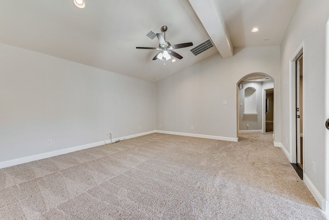 empty room featuring light colored carpet, ceiling fan, and vaulted ceiling with beams