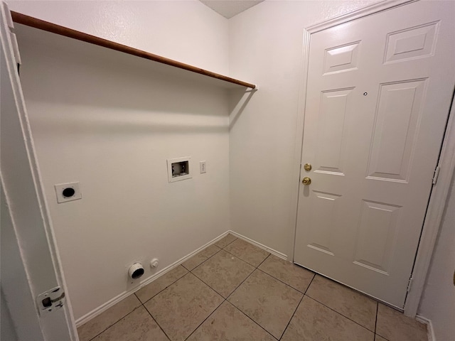 clothes washing area featuring washer hookup, light tile patterned floors, electric dryer hookup, and hookup for a gas dryer