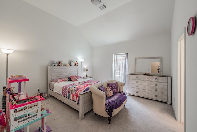 bedroom featuring lofted ceiling and light carpet