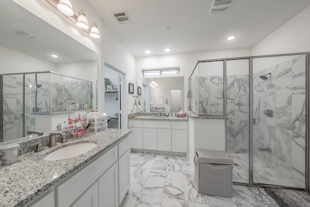 bathroom featuring walk in shower and vanity