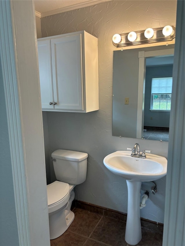 bathroom featuring tile patterned flooring and toilet