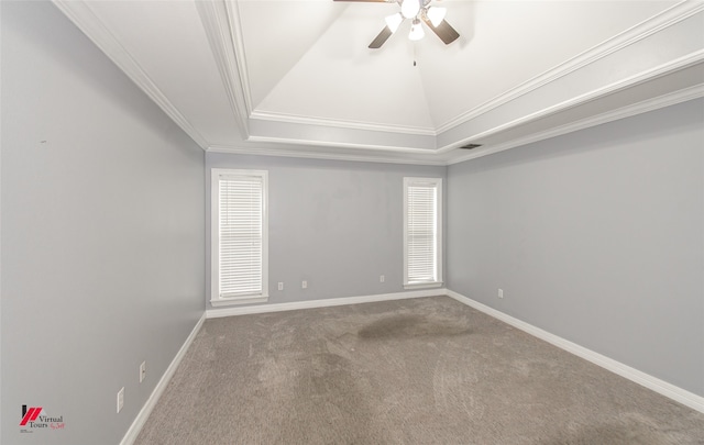 empty room featuring ceiling fan, a raised ceiling, crown molding, and carpet floors