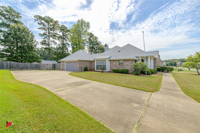 single story home with a front lawn and a garage