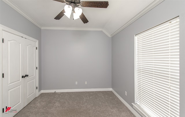 unfurnished bedroom with light carpet, vaulted ceiling, crown molding, and ceiling fan