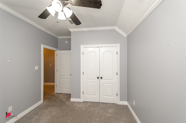 unfurnished bedroom featuring a closet, ceiling fan, light colored carpet, and ornamental molding