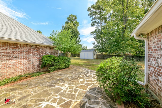 view of patio with a storage unit