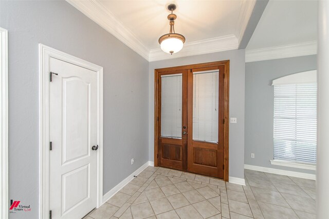 foyer featuring french doors, light tile patterned floors, and ornamental molding