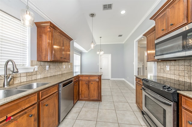 kitchen featuring ornamental molding, decorative light fixtures, appliances with stainless steel finishes, and decorative backsplash