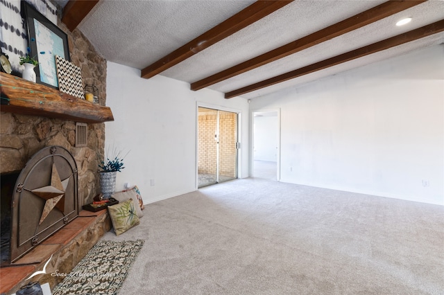 living room featuring a textured ceiling, beamed ceiling, and carpet flooring