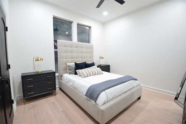 bedroom featuring light hardwood / wood-style flooring and ceiling fan