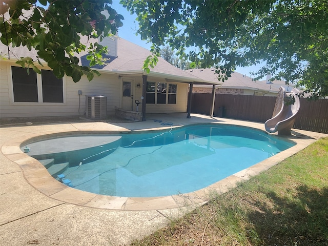 view of swimming pool featuring a water slide