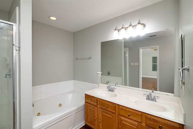 bathroom with separate shower and tub and vanity