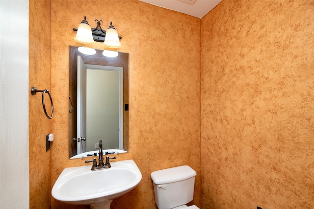 bathroom with sink and toilet