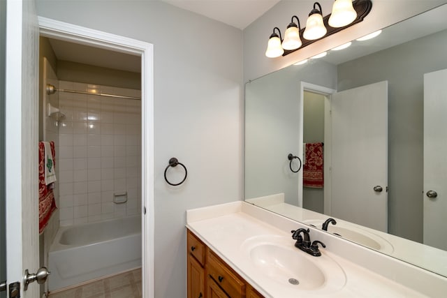 bathroom featuring vanity and tiled shower / bath combo