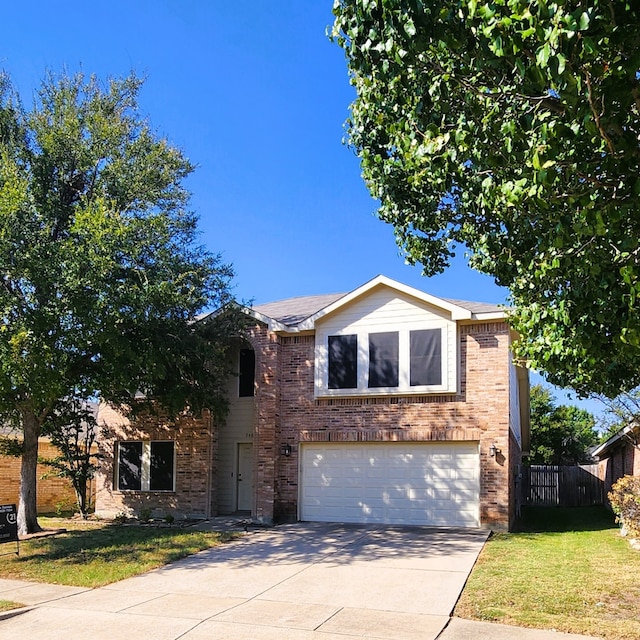 view of front of property featuring a garage and a front yard