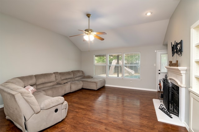 living room featuring vaulted ceiling, dark hardwood / wood-style flooring, and ceiling fan