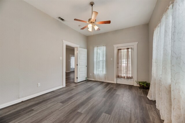 empty room featuring ceiling fan and dark hardwood / wood-style floors