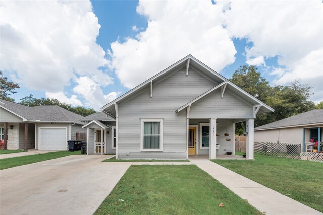 bungalow with a garage and a front yard