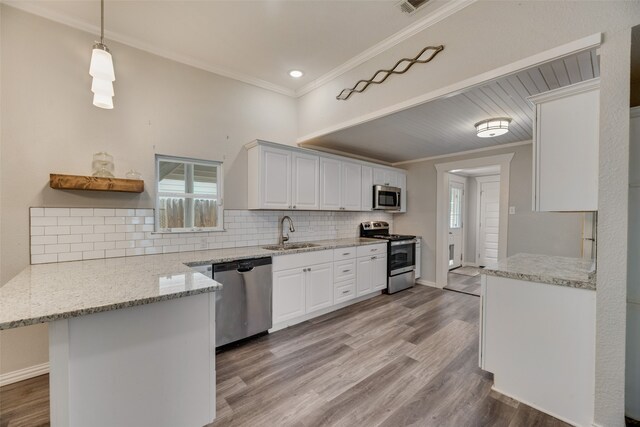 kitchen featuring light hardwood / wood-style floors, stainless steel appliances, sink, ornamental molding, and light stone counters