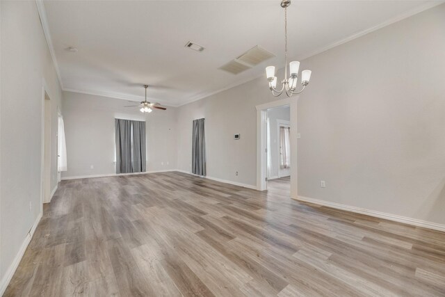 unfurnished living room with hardwood / wood-style floors, ceiling fan with notable chandelier, crown molding, and a healthy amount of sunlight