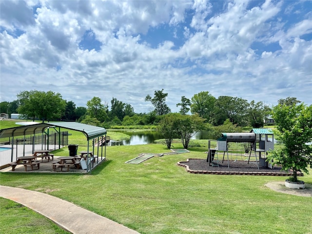 surrounding community featuring a gazebo, a lawn, and a water view