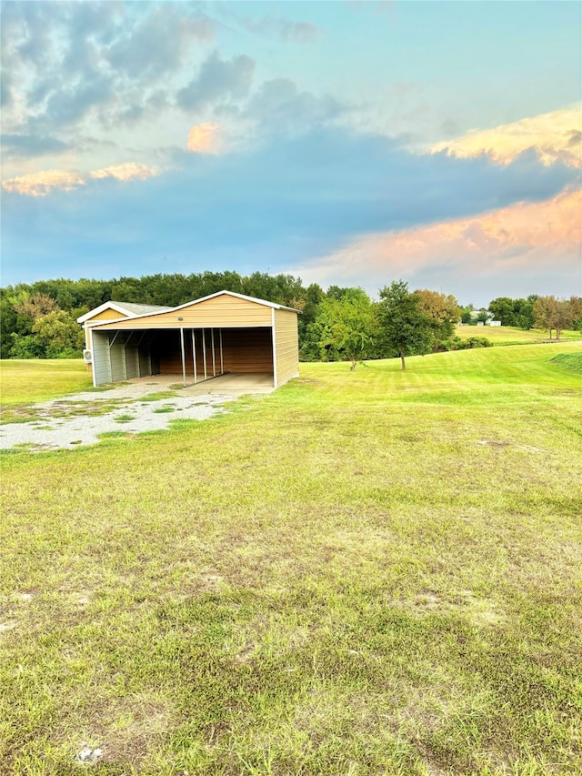 exterior space featuring a rural view and a front lawn