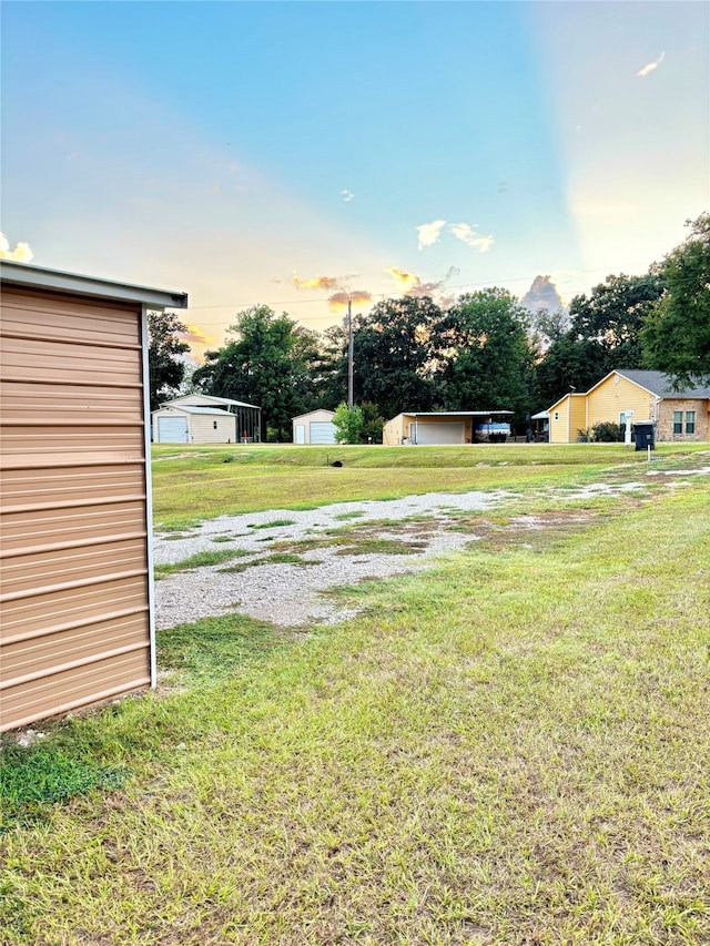 view of yard at dusk