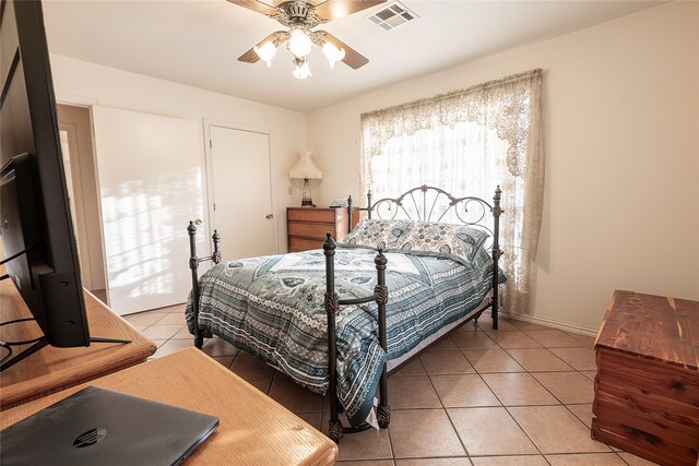 bedroom featuring tile patterned flooring and ceiling fan