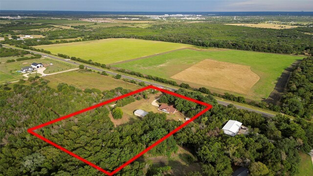 birds eye view of property featuring a rural view