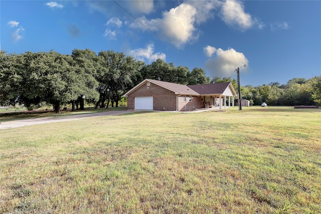 view of front of house with a front lawn and a garage