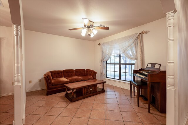 tiled living room with ornate columns and ceiling fan