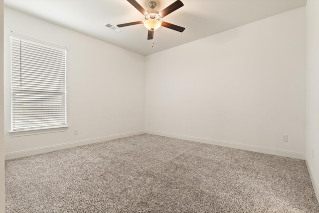 empty room featuring carpet flooring and ceiling fan