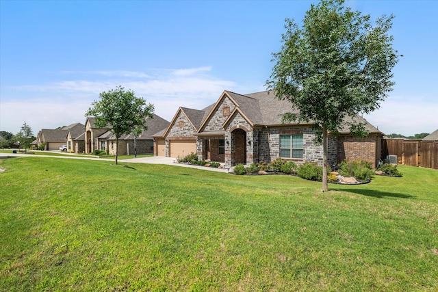 view of front of house with a front yard and a garage