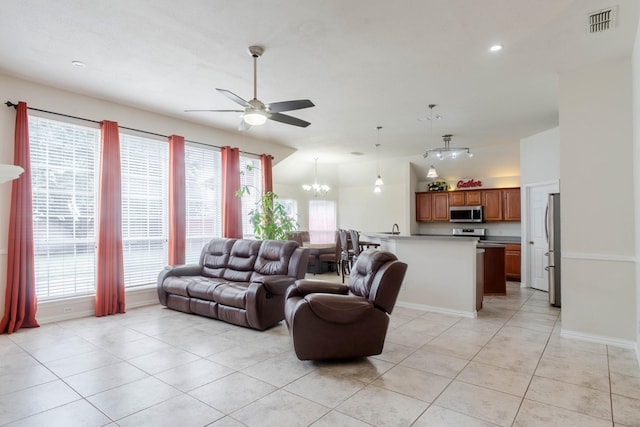 7525 Juliet Ln, Fort Worth, TX 76137 - living room with recessed lighting, baseboards, visible vents, light tile patterned flooring, and ceiling fan with notable chandelier