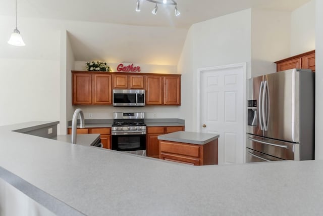 7525 Juliet Ln, Fort Worth, TX 76137 - kitchen with stainless steel appliances, brown cabinetry, decorative light fixtures, light countertops, and vaulted ceiling