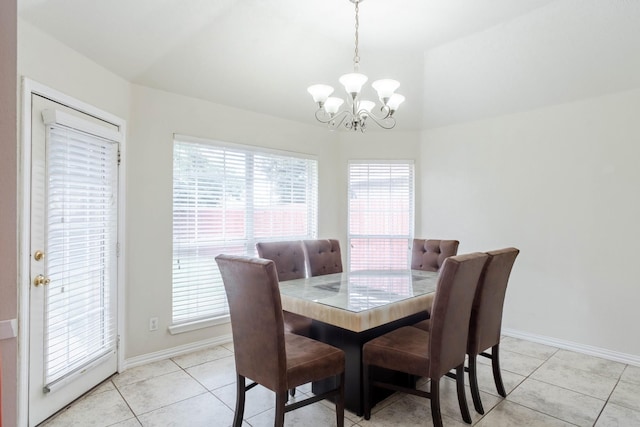 7525 Juliet Ln, Fort Worth, TX 76137 - dining space with baseboards, a chandelier, light tile patterned flooring, and vaulted ceiling