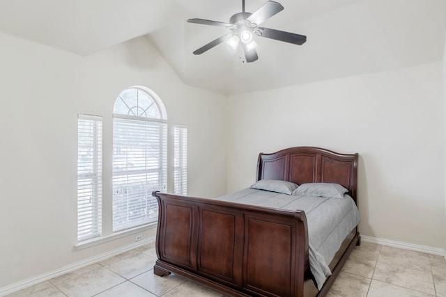 tiled bedroom with lofted ceiling and ceiling fan