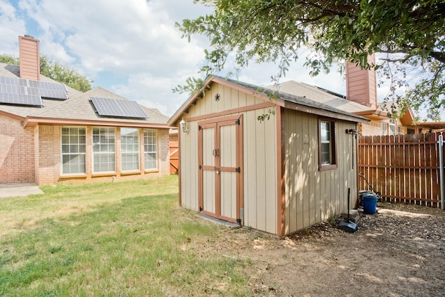 view of outdoor structure with a lawn