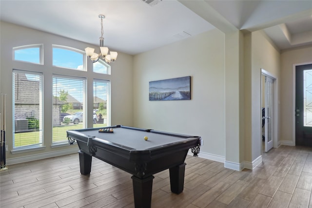 playroom featuring light wood-type flooring, billiards, and a notable chandelier