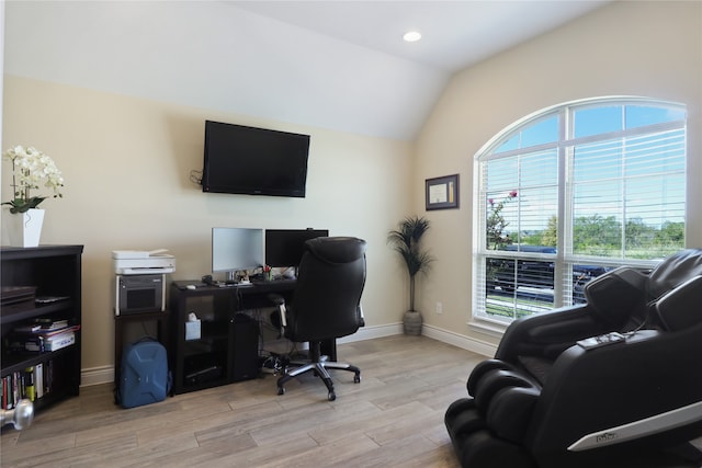 office with lofted ceiling and hardwood / wood-style floors