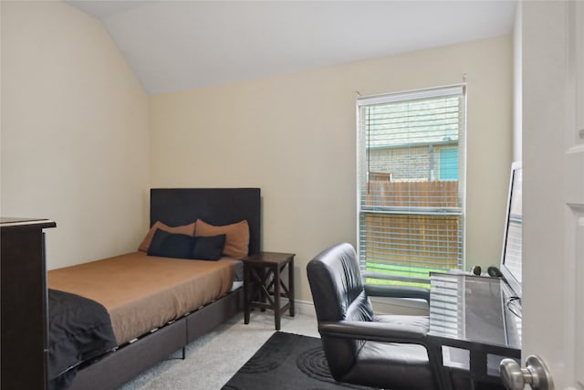 carpeted bedroom with vaulted ceiling