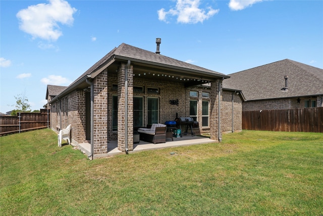 rear view of property with a lawn, a patio, and an outdoor hangout area