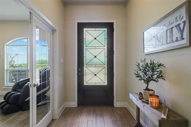 entryway with hardwood / wood-style floors and french doors