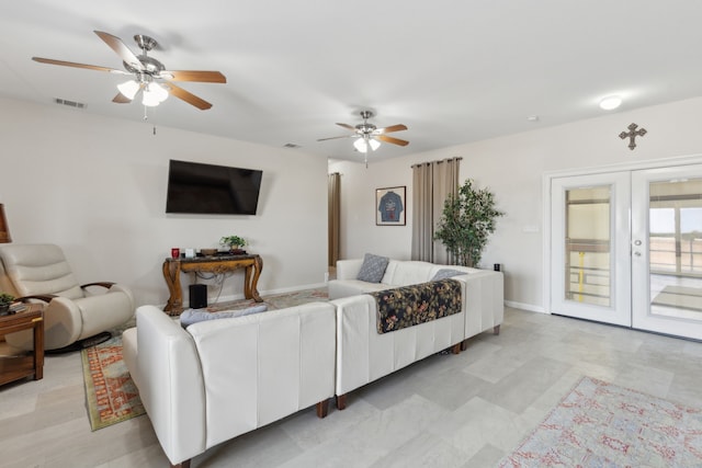 living room with ceiling fan and french doors