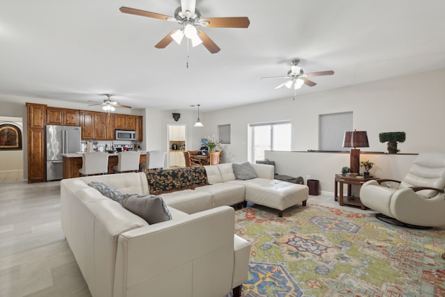 living room featuring ceiling fan