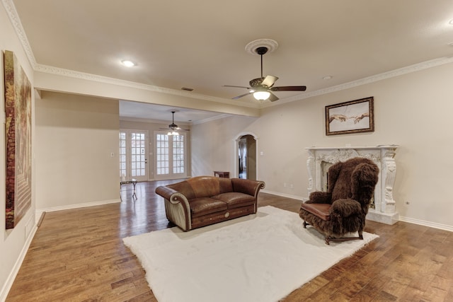 living room with crown molding, ceiling fan, french doors, and hardwood / wood-style flooring