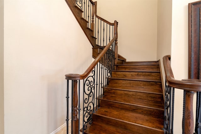 staircase featuring hardwood / wood-style floors