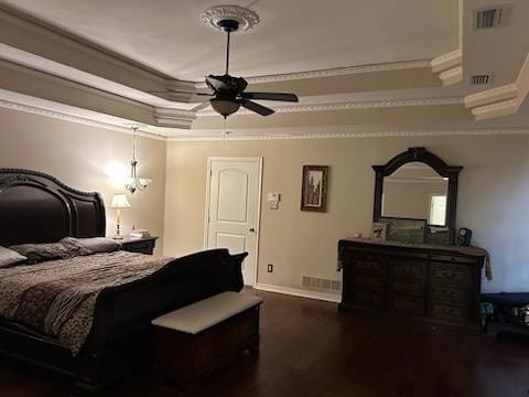 bedroom with ceiling fan, crown molding, and dark hardwood / wood-style flooring